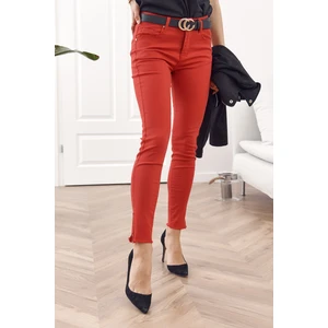 Red jeans with zippers on the legs