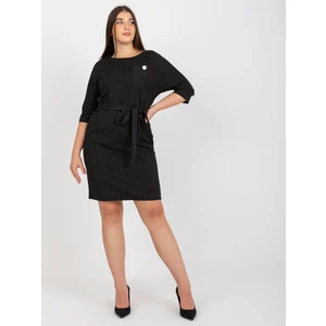 Black pencil dress of larger size with a detail for tying