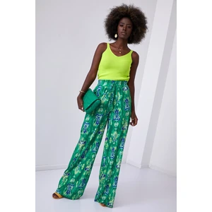 Wide women's trousers with green pattern