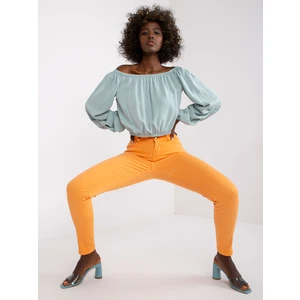 Bright orange denim pants from Marites low rise