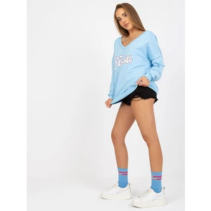 Light blue and white sweatshirt with print and V-neck