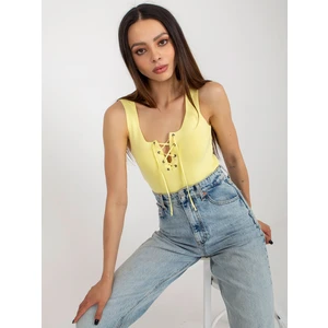 Light yellow women's top with lace-up neckline