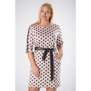 fitted polka dot dress with glittering stripes on the sleeves and a tie at the waist