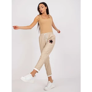 Beige trousers made of eco-leather with pockets Lana