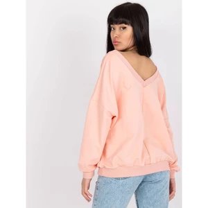 Light pink and black sweatshirt with an oversize print