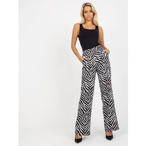 Black and white wide trousers made of animal print fabric