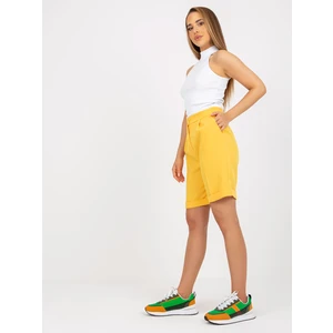 Elegant dark yellow long shorts with high waist