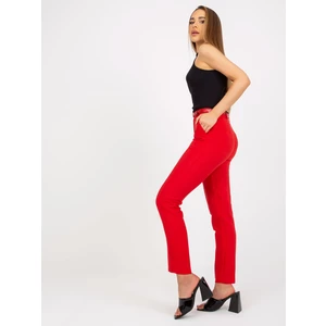 Trousers made of red fabric with belt