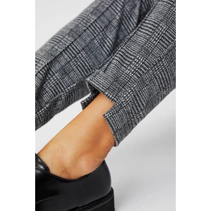 Knitted trousers with a tie