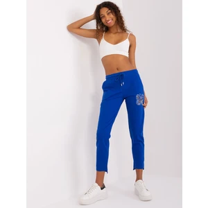 Cobalt blue sweatpants with appliqués