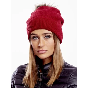 Red cap with fur pompom