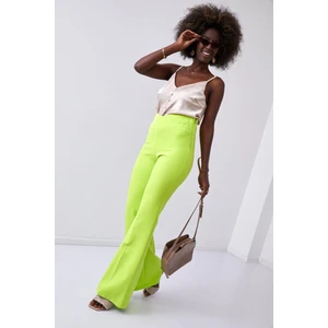 Elegant women's trousers with flared legs, neon lime