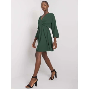 Dark green dress with a triangular neckline